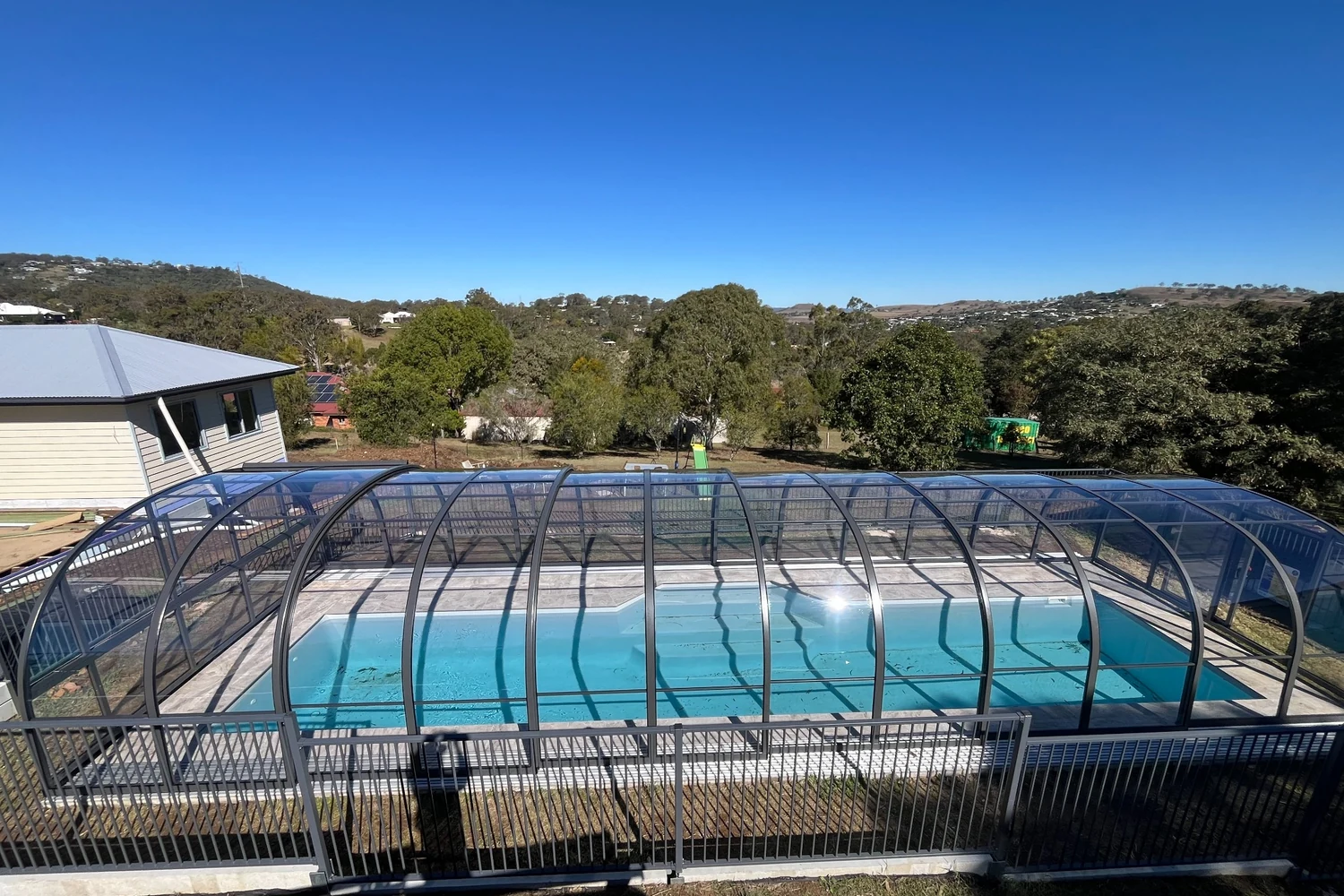 telescopic-retractable-pool cover-enclosure-dallas clear-custom-kbl pool enclosures12